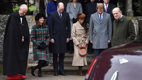 The young royal family and Markle bow and curtsy as the Queen arrives for mass. (AAP)