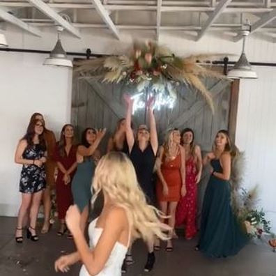Wedding guest viciously rips the bouquet from another woman's hand