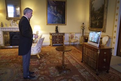 Queen Elizabeth II appears on a screen via videolink from Windsor Castle, where she is in residence, during a virtual audience to receive the Ambassador of Estonia, Viljar Lubi, at Buckingham Palace, London. Tuesday February 15, 2022. 
