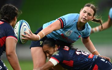 Caitlyn Halse of the Waratahs passes the ball at AAMI Park.