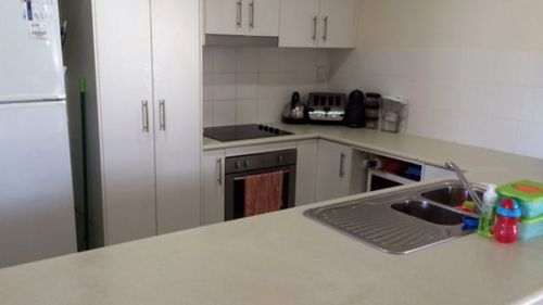 The kitchen in Angela Postle's Chinchilla home. The Queensland Environmental Health Branch have advised it is likely something in the home or environment that is causing the strange discolouration. (Angela Postle)