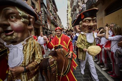 The festival also has a parade with people dressed in colourful garb ahead of the release of the bulls in Pamplona, Spain.