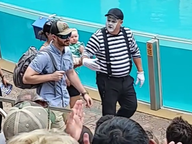 Mime calls out new dad, makes him carry backpack for mum