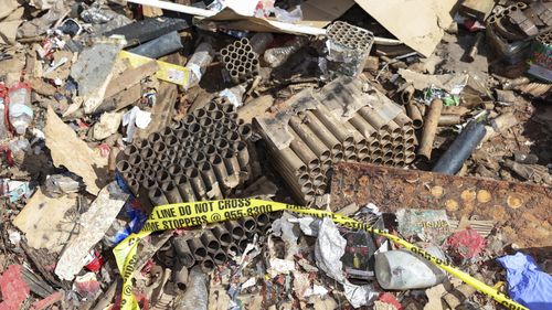 Fireworks debris is seen outside the home where a New Year's Eve fireworks explosion killed three in Honolulu. 