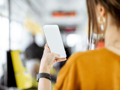 Woman phone bus