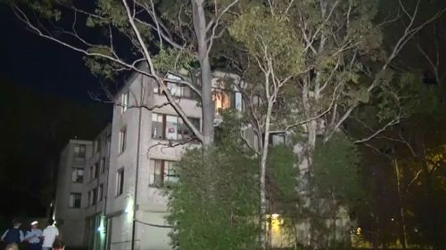 A wooden balcony railing on this unit block gave way. (9NEWS)