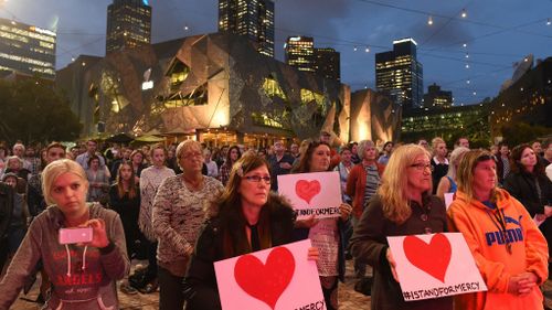 Supporters of Andrew Chan and Myuran Sukumaran gather for a vigil at Federation Square in Melbourne. (AAP)