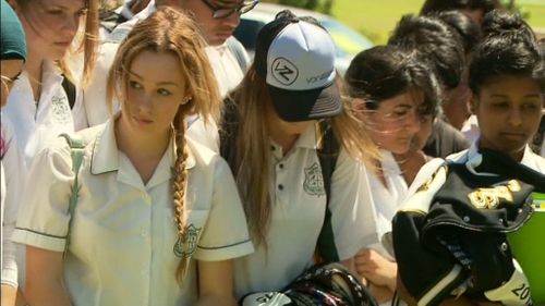 Students have marched upon a home in Casula, where a woman was allegedly killed by her husband. (9NEWS)