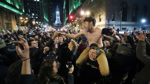 Philadelphia Eagles fans celebrate the team's victory in NFL Super Bowl 52 between the Philadelphia Eagles and the New England Patriots. (AAP)