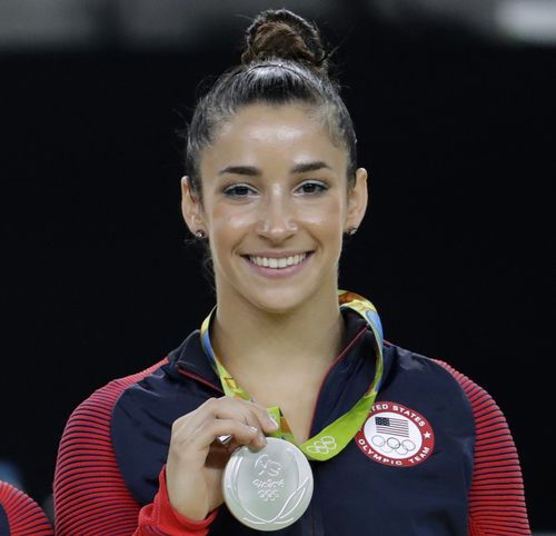 Aly Raisman shows off her silver medal after the artistic gymnastics women's apparatus final at the 2016 Summer Olympics in Rio de Janeiro, Brazil. Picture: AAP