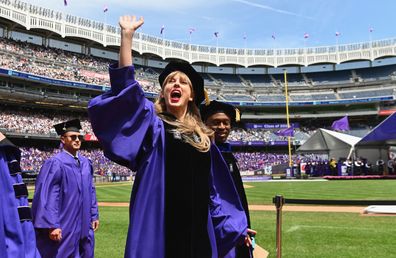 Taylor Swift waves at graduating students during New York University's commencement ceremony for the class of 2022, at Yankee Stadium in New York City on May 18, 2022. 