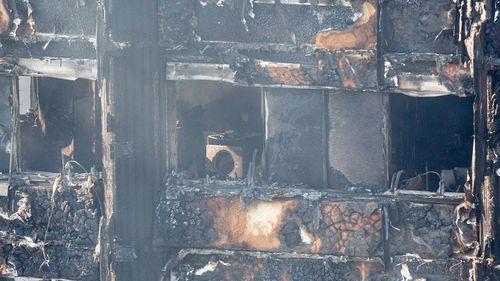 A view through the window of one of the gutted apartments of the Grenfell Tower. (AAP)