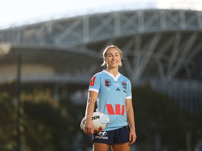 Abbi Church poses in her NSW Blues Women's State of Origin kit.
