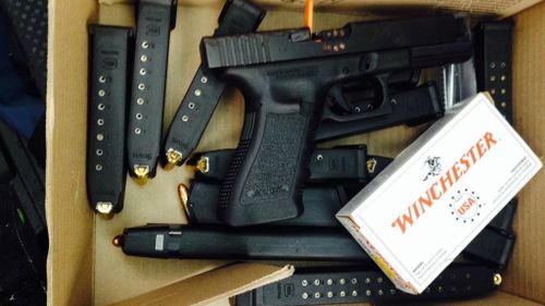 Glock with loaded magazines found during a police raid in Sydney's southwest. (supplied)