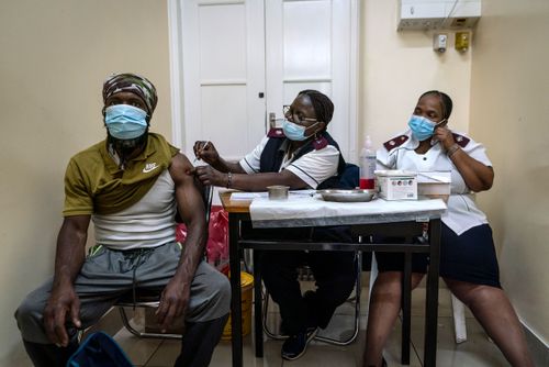 A man is vaccinated against COVID-19 at the Hillbrow Clinic in Johannesburg, South Africa