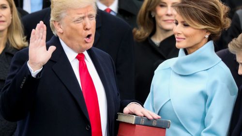 Mr Trump takes the oath of office. (AAP)