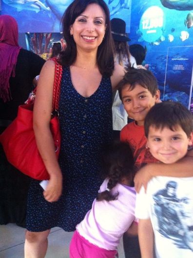 Jo Abi with three children