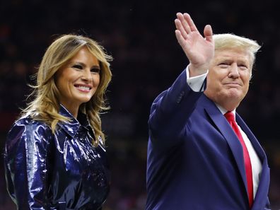 President Trump escorts Melania off the field prior to the College Football Playoff National Championship Game on January 13, 2020.