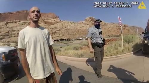 This police cam video provided by the Moab Police Department shows Brian Laundry speaking to a police officer after police stopped the truck he was traveling in with Gabe Pettito, near the entrance to Arques National Park on August 12, 2021.