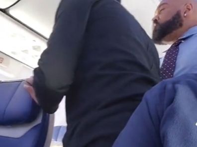 Several flight attendants attempted to reason with the angry man. 