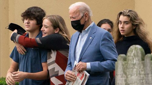 Joe Biden leaves church with some of his grandchildren on Sunday.