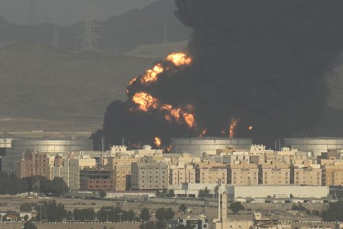 A cloud of smoke rises from a burning oil depot  in Jiddah, Saudi Arabia, Friday, March 25, 2022 