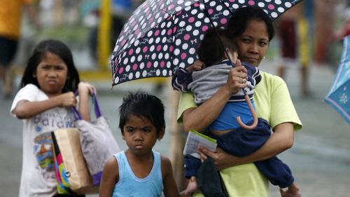 At least 23 dead as typhoon churns towards Philippine capital