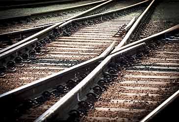 What is the width between the rails of standard gauge tracks?