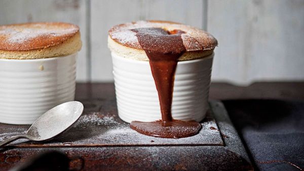 White chocolate souffles with milk chocolate sauce