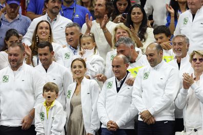 Wife Jelena Djokovic and son Stefan celebrate with the rest of Novak Djokovic's his team after the Serbian defeated Daniil Medvedev in the men's singles final at the US Open.