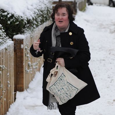 Susan Boyle arrives home in the snow as the United Kingdom is swept by snowstorms and blizzards on December 22, 2009 in Blackburn, Scotland.