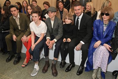 Brooklyn Beckham, Hana Cross, Cruz Beckham, Romeo Beckham, Harper Beckham, David Beckham and Dame Anna Wintour attend the Victoria Beckham show during London Fashion Week February 2019 at Tate Britain on February 17, 2019 in London, England.