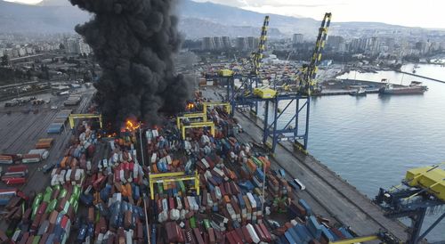 Smoke rises from burning containers at the port in the earthquake-stricken town of Iskenderun, southern Turkey.
