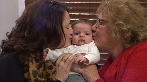 Ms Patten and Mrs Patten-Barwiese with their very special bundle of joy. (9NEWS)