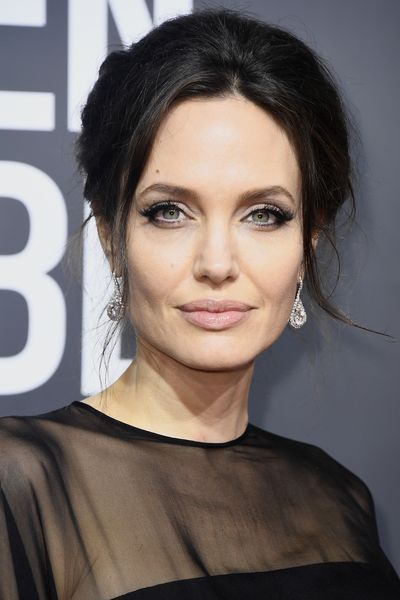 Angelina Jolie has kept her make-up and hair simple and eyes dramatic. These cat eyes are everything.