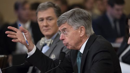 The top US diplomat in Ukraine William Taylor, centre, and career Foreign Service officer George Kent, left, testify before the House Intelligence Committee on Capitol Hill in Washington.