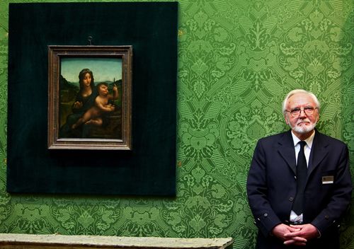 Joe Hay, security guard at the National Gallery of Scotland, stands beside the Leonardo da Vinci painting 'Madonna Of The Yarnwinder' on March 1, 2010 in Edinburgh, Scotland. (Getty)