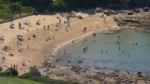 A child and an adult have died after being swept off the rocks at Sydney's Little Bay.