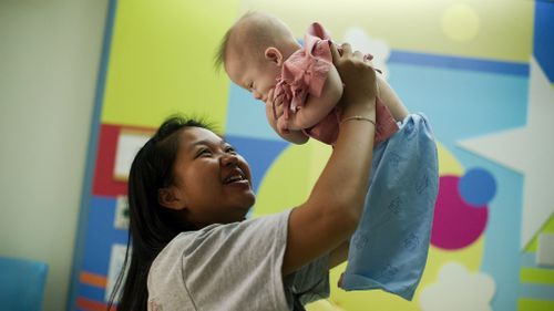 Thai surrogate mother Pattaramon Chanbua plays with her baby Gammy. (Getty Images)