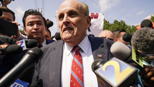 Rudy Giuliani speaks outside the Fulton County jail, Wednesday, Aug. 23, 2023, in Atlanta. 