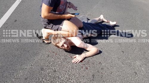 Moments before stripping off, the driver allegedly crashed into another car. (9NEWS)