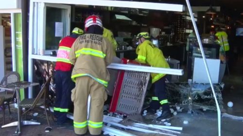 Fire crews assisted cafe staff with the clean up this afternoon. (9NEWS)