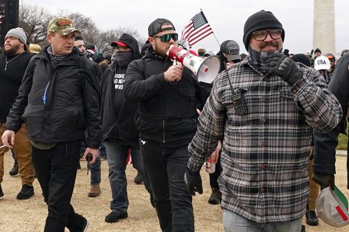 Proud Boys members including Zachary Rehl (left), Ethan Nordean, (centre), and Joseph Biggs (right), walk toward the US Capitol in Washington, in support of President Donald Trump on January 6, 2021 