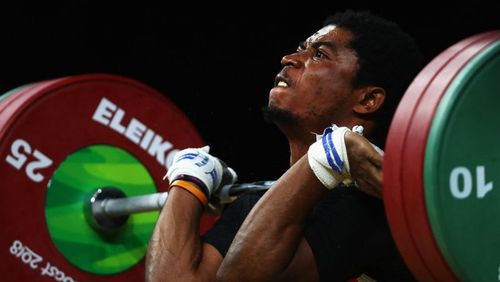 Olivier Heracles Matam Matam of Cameroon competes during the weightlifting men's 62kg final. (Getty)