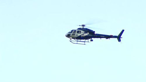 A POLAIR helicopter hovered over head. (9NEWS)