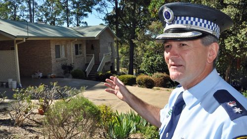 Superintendent Paul Fehon points to the house where three-year-old William Tyrell was last seen on the Mid North Coast of NSW, Thursday, Sept. 18, 2014.