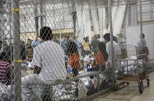 Immigrants are kept in cages at a facility in McAllen, Texas. Picture: AAP