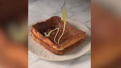 You need to press in the middle of the toast to make a 'lava pit'.