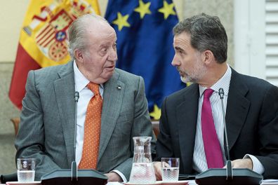 King Felipe VI of Spain (R) and King Juan Carlos (L) attend a meeting with COTEC Foundation at the Royal Palace on May 14, 2019 in Madrid.