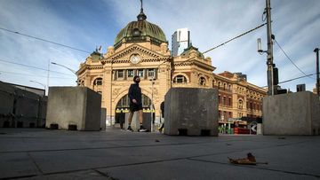 The normally busy intersection of Flinders and Swanston streets outside Flinders Street station in Melbourne.